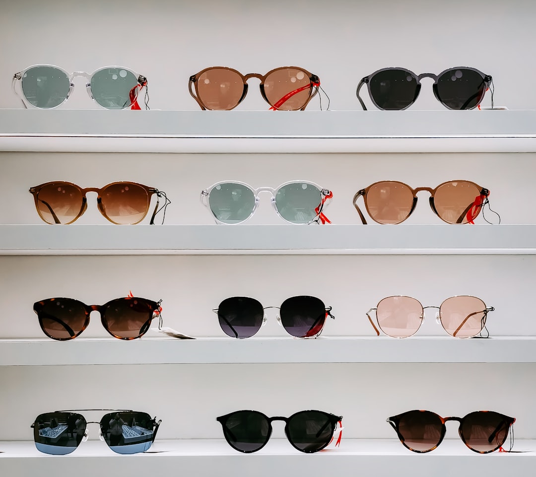black-framed-sunglasses-on-white-surface-egqznnzjxng